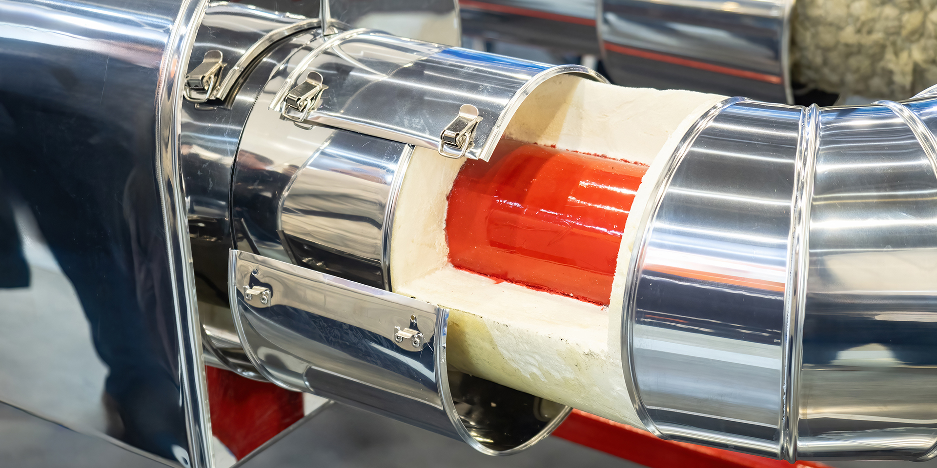 Pipe is protected by polyurethane foam and steel casing. Pipeline fragment. Galvanized body on thin pipe. Sectional fragment of pipeline. Production equipment. Pipe production concept